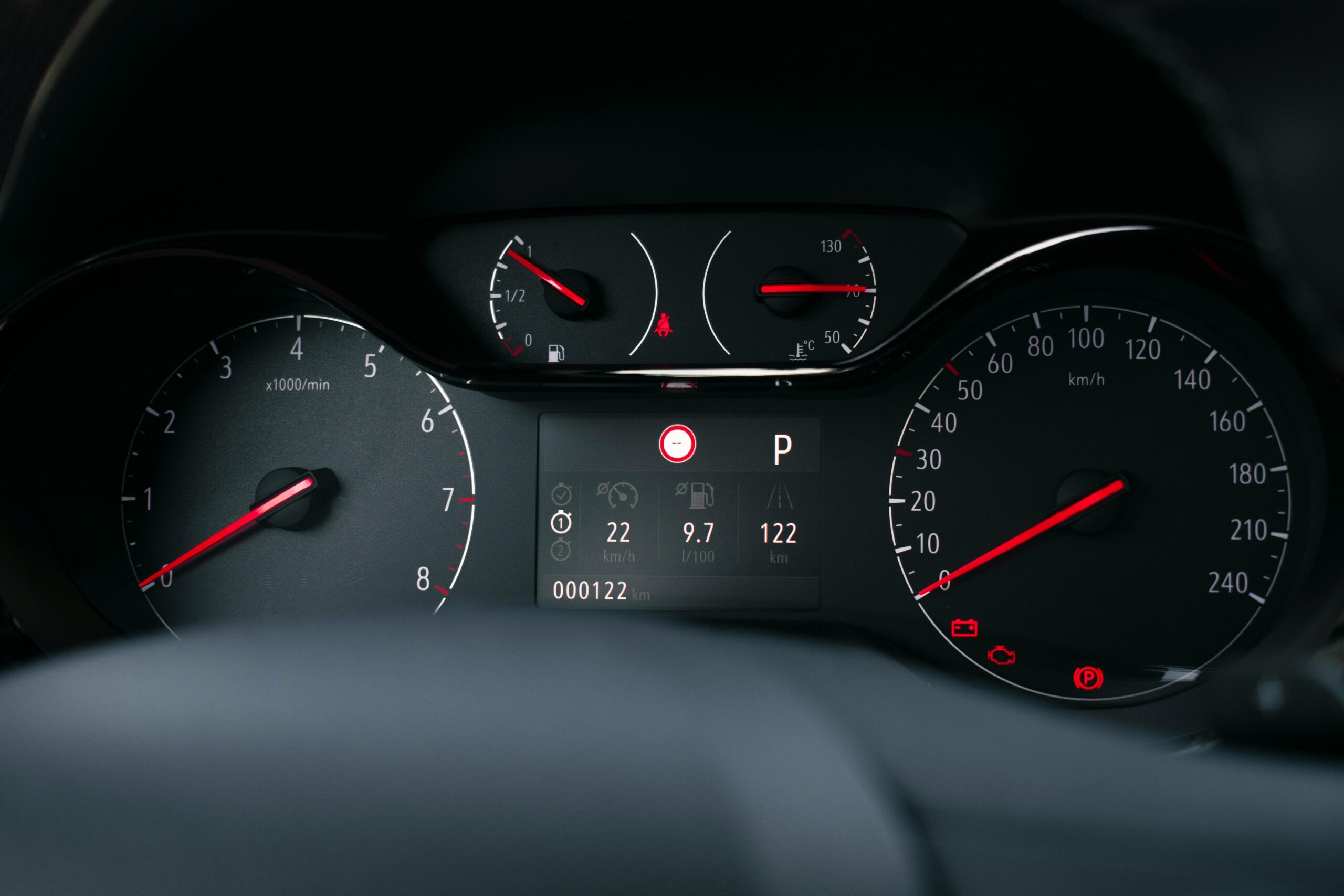car dashboard, check engine light is on.