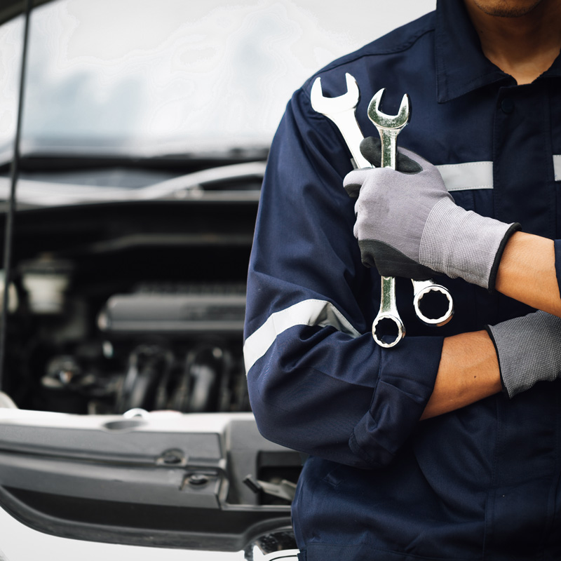 mechanic with tools in hand